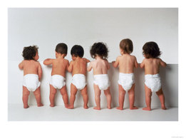 babies in diapers facing the wall